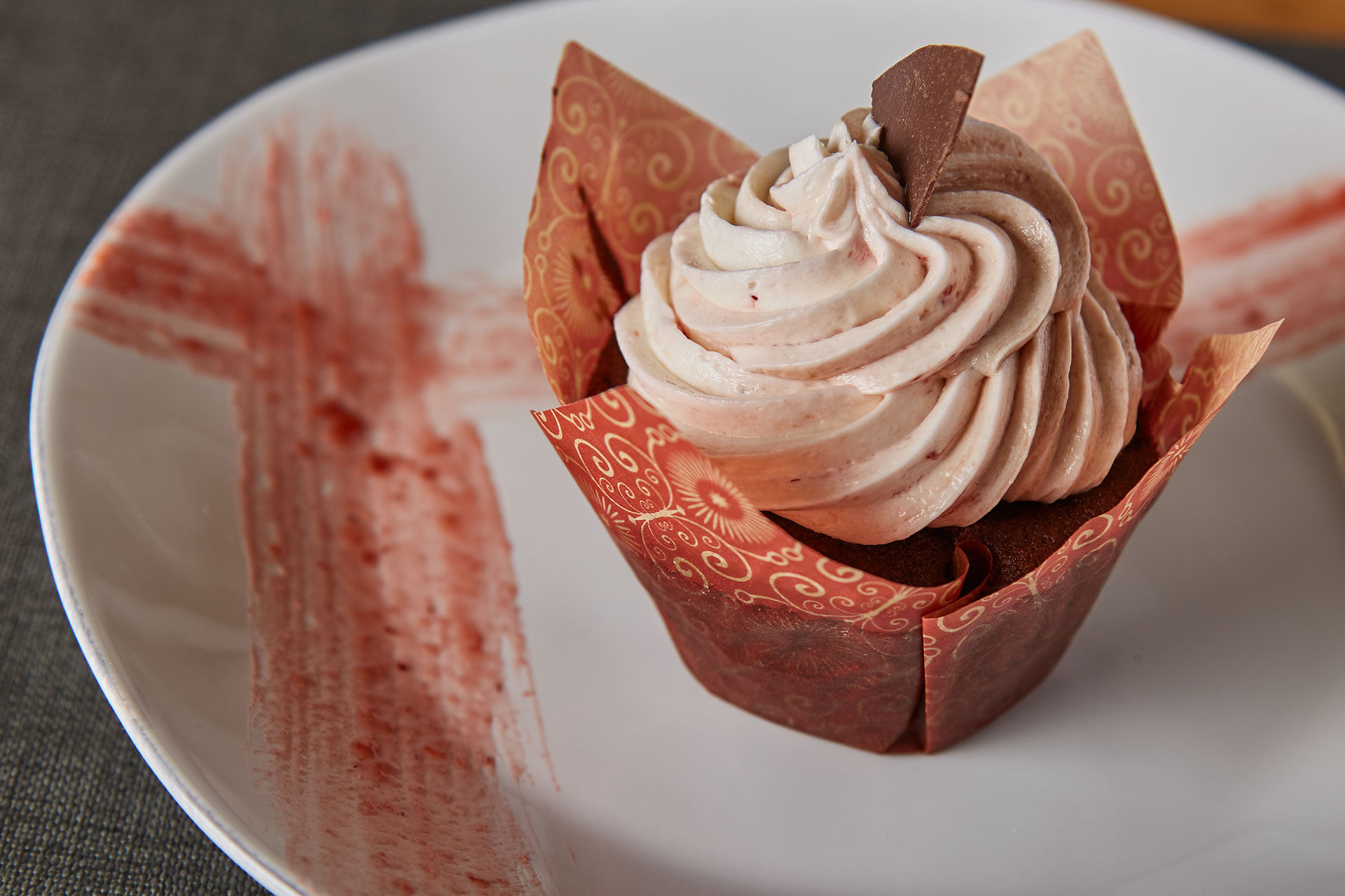 strawberry cupcake on white plate