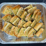 Garlic Bread Slices in a foil catering tray