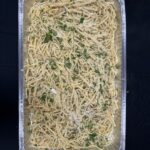 Pasta aglio e olio in catering foil tray