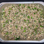 catering foil tray with a mix of quinoa and broccolis