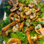 sautéed shrimps on a bed of lettuce