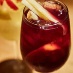 glass with red wine homemade sangria and fruits