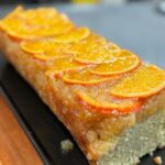 Orange cake on top of wooden counter